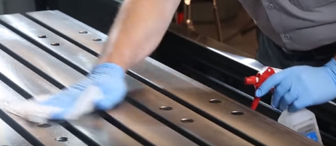 Clean the table with a solvent or alcohol